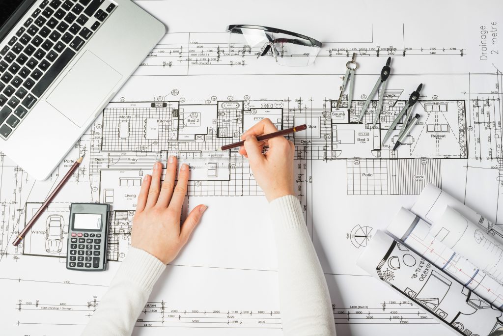 Architect reviewing blueprints