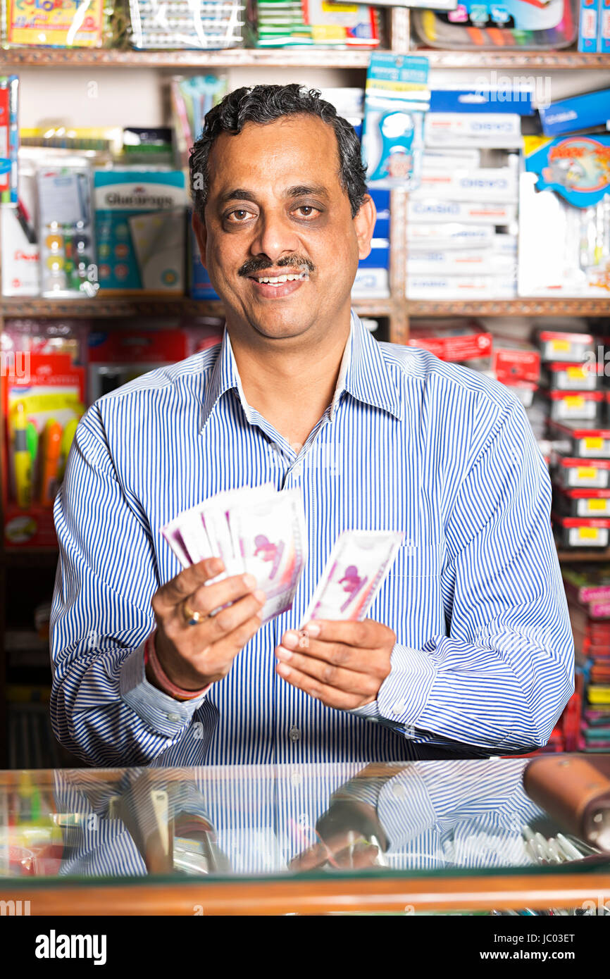 Bangladeshi Shopkeeper Counting Money